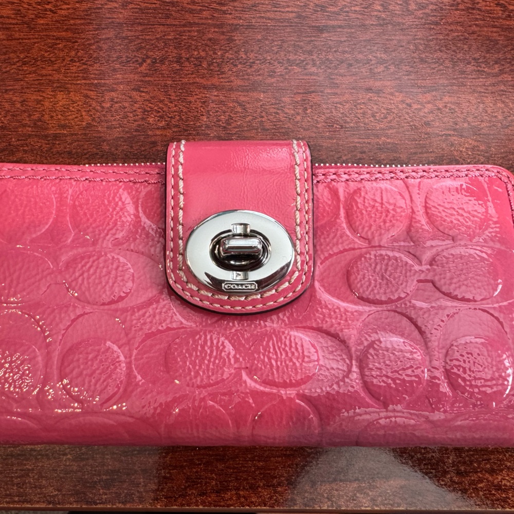 Coach Pink/Rose-colored patent leather zip and toggle wallet